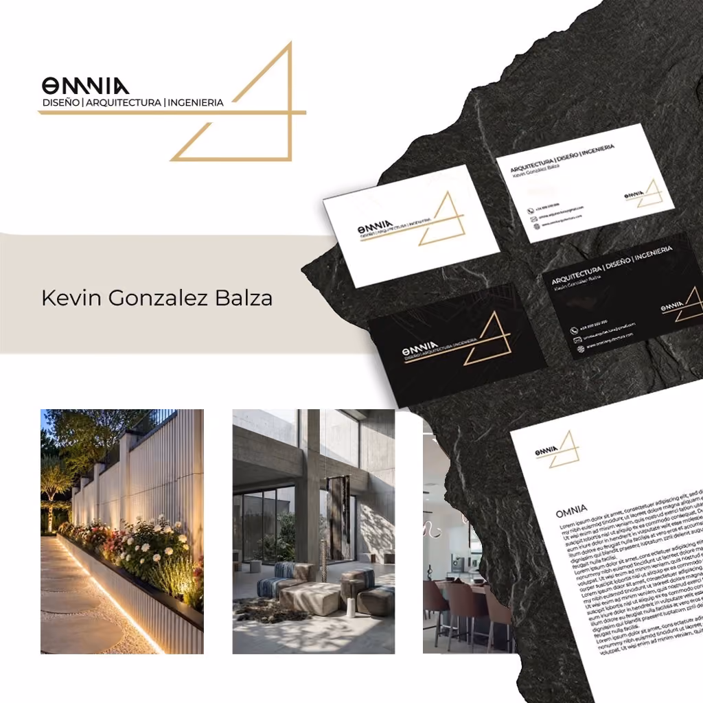Identidad de marca de Omnia: logotipo, tarjetas de presentación y papelería corporativa sobre una losa de pizarra