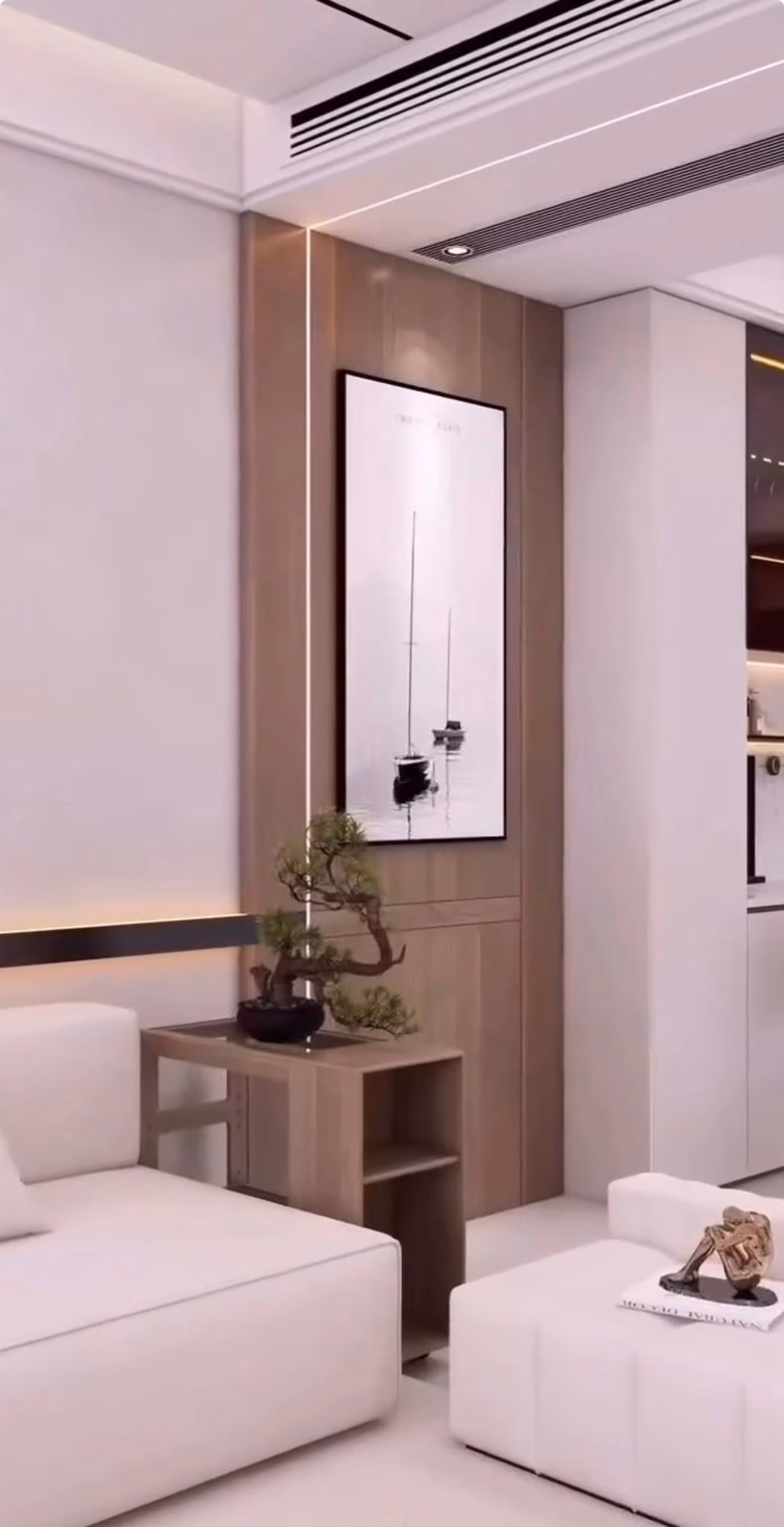 Salón con sofás en blanco, panel de madera y vista hacia la cocina abierta
